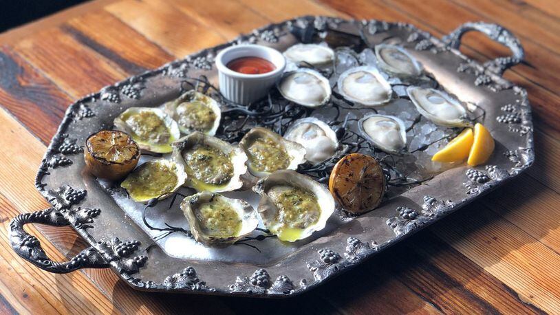 Platter of oysters, half grilled and half raw, at Kimball House in Decatur. CONTRIBUTED BY: Kimball House