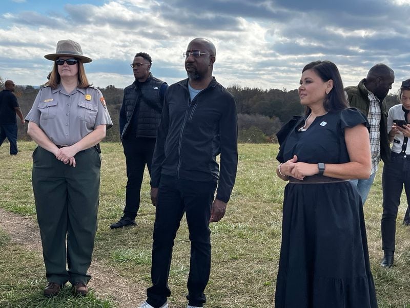 U.S. Sen. Raphael Warnock (center) is pictured visiting the Ocmulgee Mounds National Historic Park.