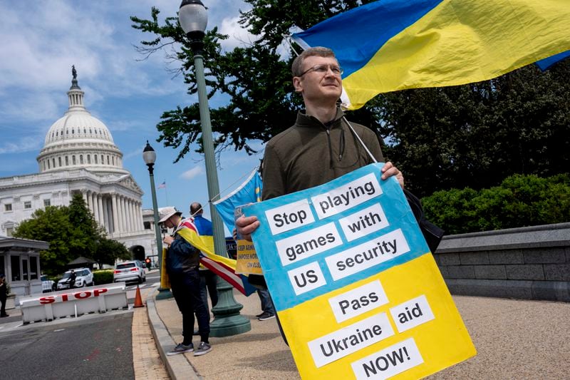 FILE - Activists supporting Ukraine, demonstrate outside the Capitol in Washington, April 20, 2024. The Senate is returning to Washington to vote on $95 billion in war aid to Ukraine and Israel. They are taking the final steps in Congress to send the legislation to President Joe Biden's desk after months of delays and contentious internal debate over how involved the United States should be abroad. (AP Photo/J. Scott Applewhite)