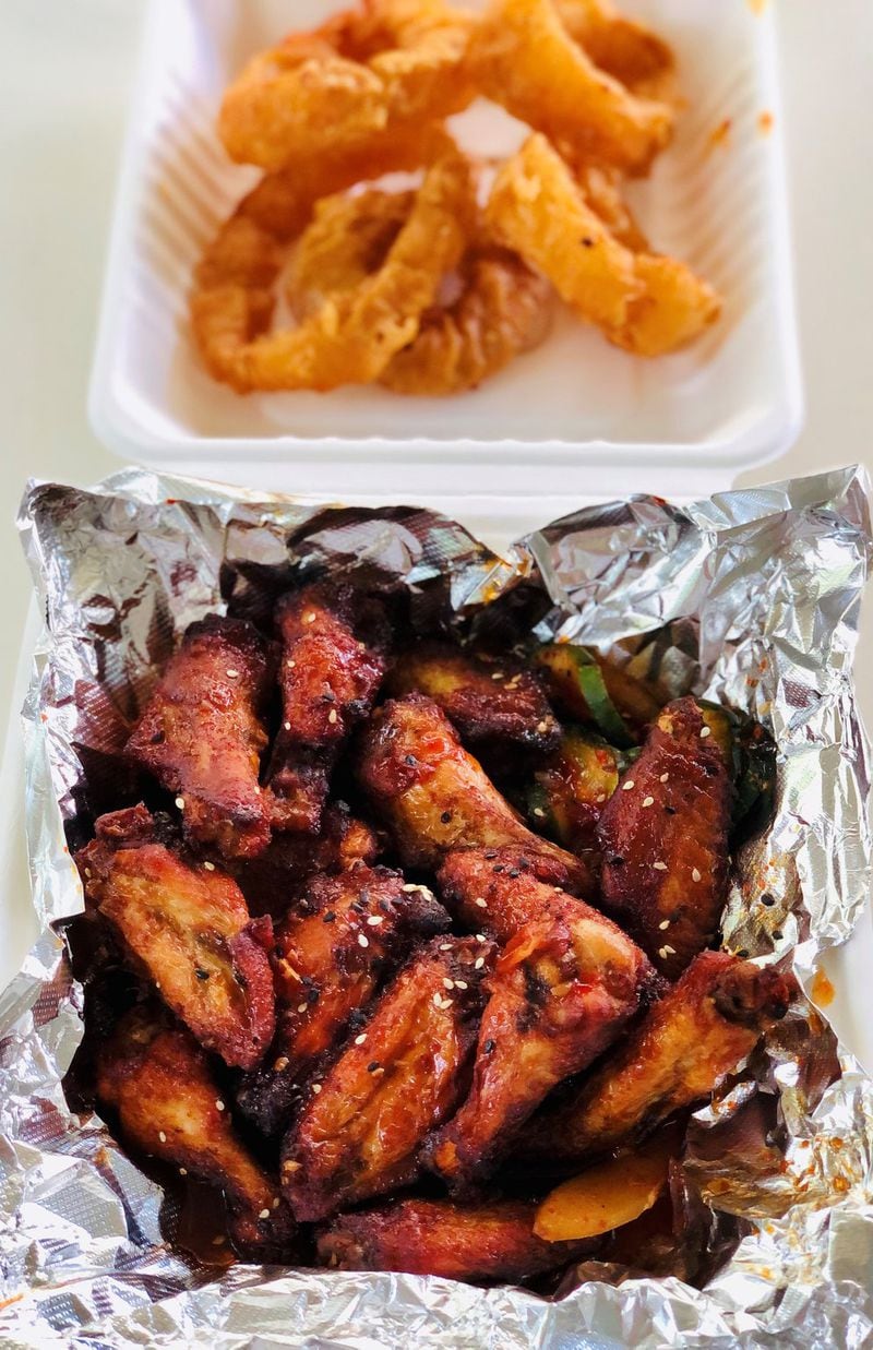 This order of spicy chicken wings and onion rings came from Heirloom Market BBQ. CONTRIBUTED BY WENDELL BROCK
