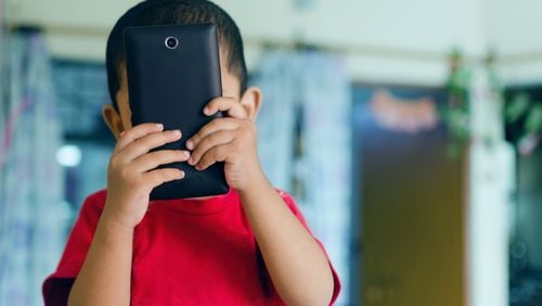School districts should learn from international research showing smartphones are near impossible to regulate and classroom bans may be the only solution to stopping students from being distracted by them. (Dreamstime/TNS)