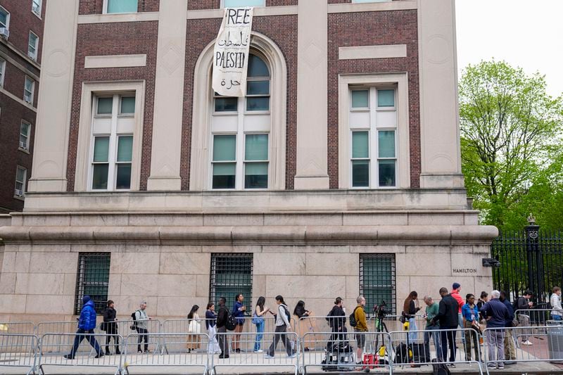 Students and staff line up outside Hamilton Hall to enter the Columbia University campus, Tuesday, April 30, 2024, in New York. (AP Photo/Mary Altaffer)
