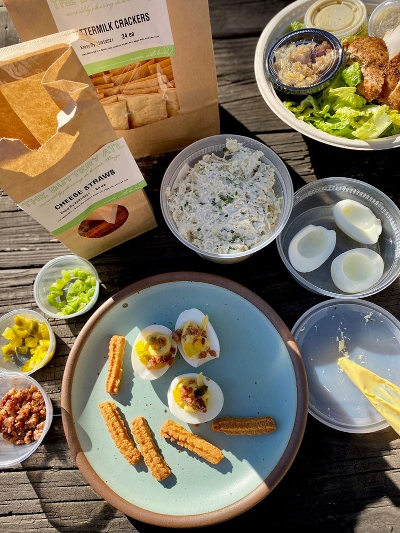 The Buttery is a swell spot for picking up cocktail snacks, lunch or picnic fixings — such as chicken salad, cheese straws, buttermilk crackers, a Caesar with chicken, and a deviled egg kit. Wendell Brock for The Atlanta Journal-Constitution