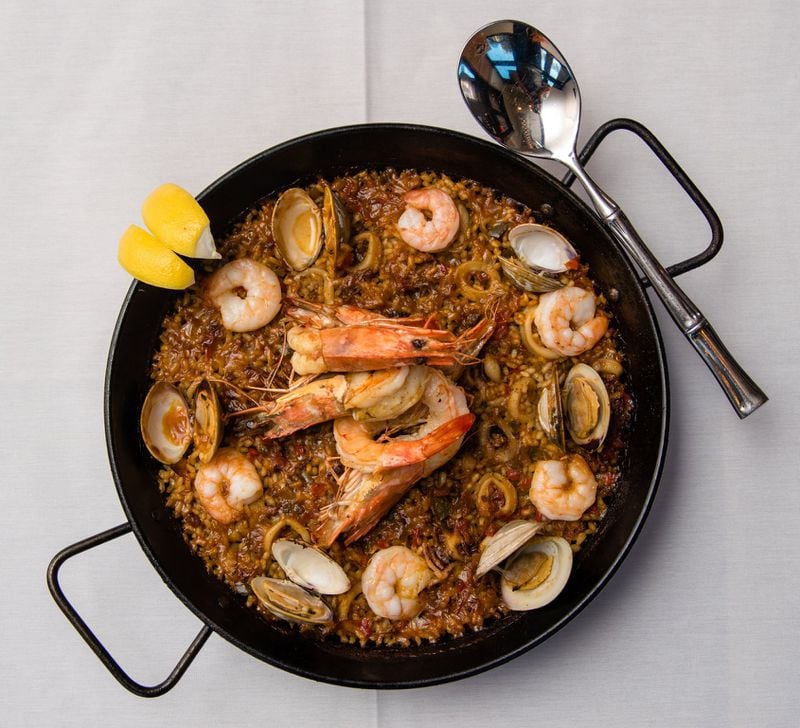 Bulla serves paella in its traditional cooking pan called a paellera, studded with seafood including prawns, shrimp, calamari and clams. CONTRIBUTED BY HENRI HOLLIS