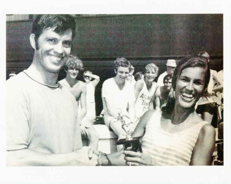Tim Singleton, one of the AJC Peachtree Road Race co-founders (left), and women's winner Gayle Barron after the 1970 race.