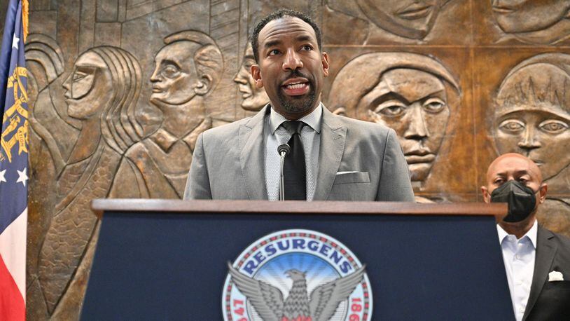 February 3, 2022 Atlanta - Mayor Andre Dickens announces the settlement with Integral Group CEO Egbert Perry (not pictured) and the Atlanta Housing Authority President Eugene Jones (right) during a press conference at Atlanta City Hall on Thursday, February 3, 2022. (Hyosub Shin / Hyosub.Shin@ajc.com)