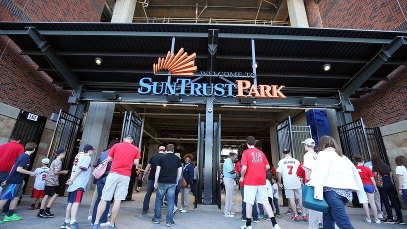 Fans enter SunTrust Park for the Braves-Yankees exhibition game on March 31. JASON GETZ / SPECIAL