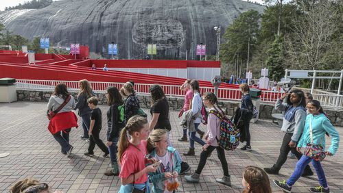 Visitors explore Stone Mountain Park on February 16, 2018. The NAACP DeKalb County Branch is recommending removing Confederate symbols at the park but not the controversial sculpture on the mountain. SPINK/JSPINK@AJC.COM