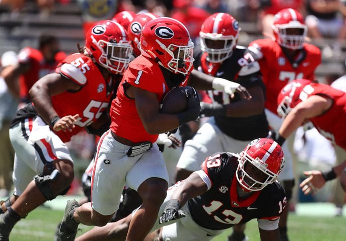 Georgia running back Trevor Etienne picks up a first down during the G-Day game on Saturday, April 13, 2024.  Curtis Compton for the Atlanta Journal Constitution