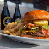 A cheddar burger with bacon is on the menu at Smoq'n Hot Grill, which is closing its location in the Collective Food Hall at Coda. / Courtesy of Smoq'n Hot Grill