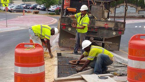 Crews working on day three of classes to finish the roundabout outside Pope High School, which opened the day before classes started, the transportation agency said.