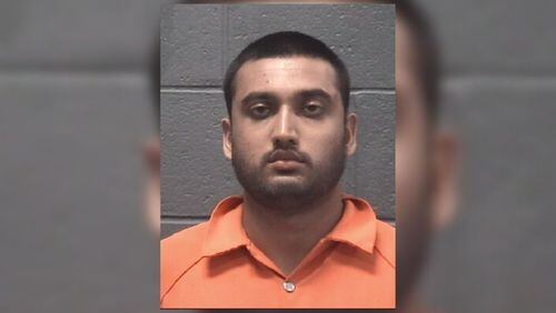Rajeev Kumaraswamy, 25, was charged with murder in connection with the shooting of his father, police said.
