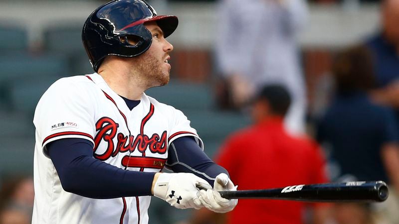 Freddie Freeman hits a double in the first inning against the New York Mets April 11, 2019, at SunTrust Park in Atlanta.