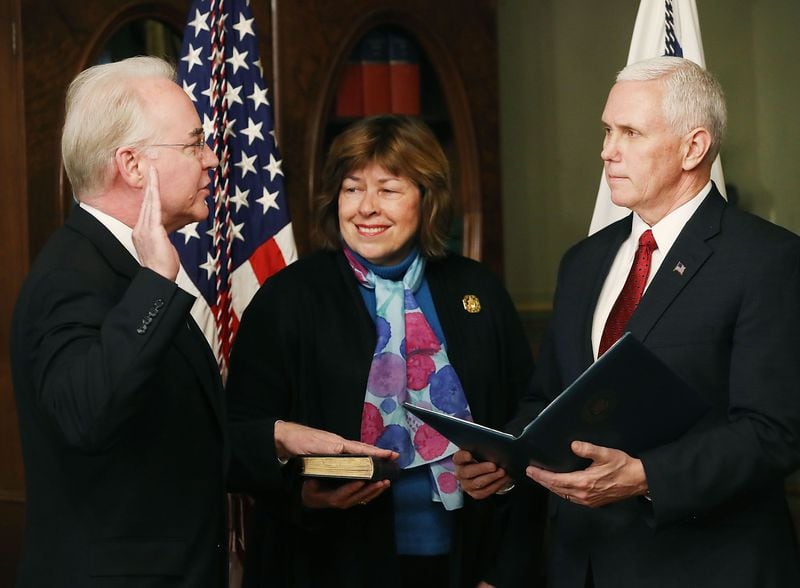 Betty Price (center) is pictured between Vice President Pence (right) and her husband Tom Price (left) as Tom Price gets sworn in as the Health and Human Services secretary earlier this year. Tom Price later resigned in wake of a travel spending scandal.