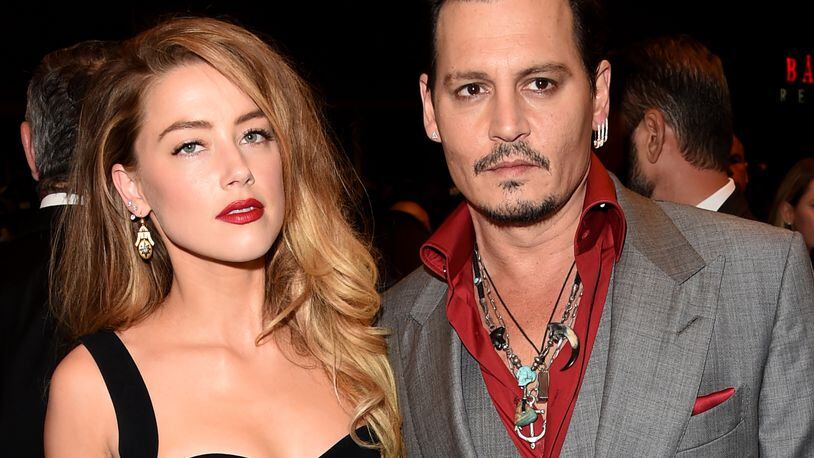 TORONTO, ON - SEPTEMBER 14: Actors Amber Heard (L) and Johnny Depp attend the "Black Mass" premiere during the 2015 Toronto International Film Festival at The Elgin on September 14, 2015 in Toronto, Canada. (Photo by Jason Merritt/Getty Images)