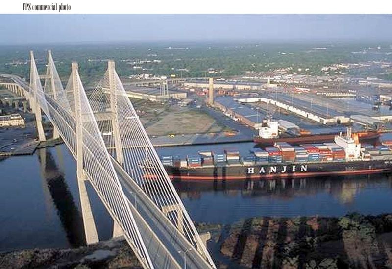 A cargo ship on the Savannah River passes under the Eugene Talmadge Memorial Bridge. AJC file