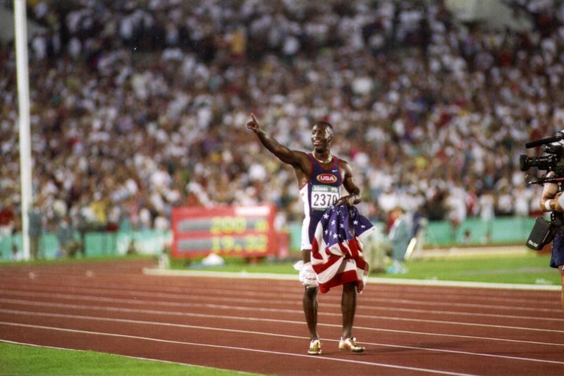 U.S. sprinter Michael Johnson celebrates winning the 200-meter event at the 1996 Olympics. Courtesy of Jeff Najarian
