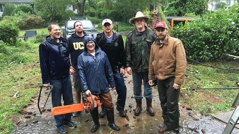 Former AJC reporter Michelle Hiskey’s Clairmont Heights neighbors came to her rescue: Michael Dowling (from left), Ian Sifuentes, Bert Ackermann, Scott Davis, Dana Atwood and Luke Love. (Photo by Michelle Hiskey)