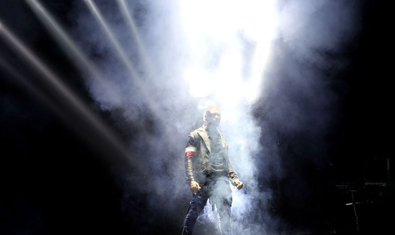Dec. 9, 2014 - ATLANTA: Best-selling, multiple-award winning musician, songwriter, dancer and actor Usher brings his UR Experience Tour back home to Atlanta performing at the Philips Arena with opening acts August Alsina and DJ Cassidy. (Akili-Casundria Ramsess/Special to the AJC) Yep, that's a dramatic entrance. Photo: Akili-Casundria Ramsess/Special to the AJC