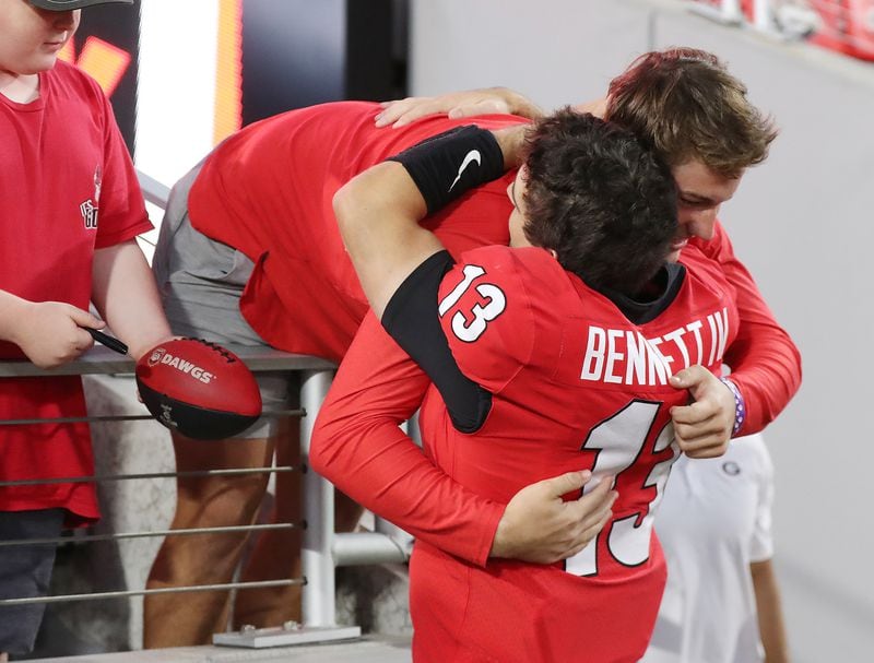 Georgia quarterback Stetson Bennett gets a hug from his brother Knox Bennett after beating Kentucky 30-13 in a NCAA college football game on Saturday, Oct. 16, 2021, in Athens.   “Curtis Compton / Curtis.Compton@ajc.com”