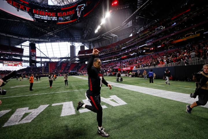 Falcons quarterback Marcus Mariota leaves the field after Atlanta defeated the Browns 23-20 on Sunday at Mercedes-Benz Stadium in Atlanta. (Miguel Martinez / miguel.martinezjimenez@ajc.com)