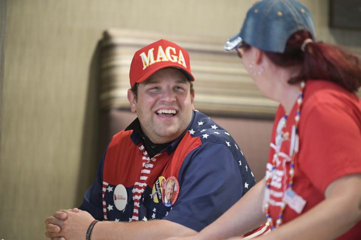 Ryan Sewell of Dalton and Melissa Johnson of Tunnel Hill share a laugh while waiting for U.S. Rep. Marjorie Green Tuesday, May 24, 2022 at the Courtyard by Marriott in Rome, Ga. (Daniel Varnado/For the Atlanta Journal-Constitution)