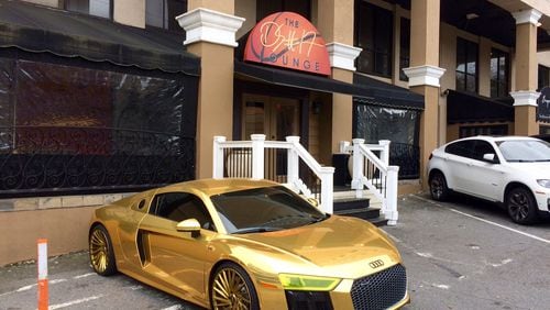 The golden Audi R8 (list price starts at $163,000) belonging to Atlanta Hawks star Dennis Schroder is often spotted outside his nightclub in Buckhead. (Photo by Bill Torpy)