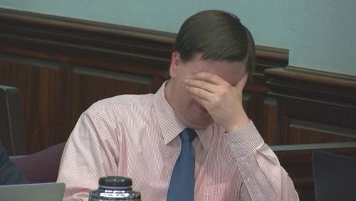 During testimony last week, Justin Ross Harris reacts to hearing his brother testify about a trip their families took together. (Screen capture via WSB-TV)