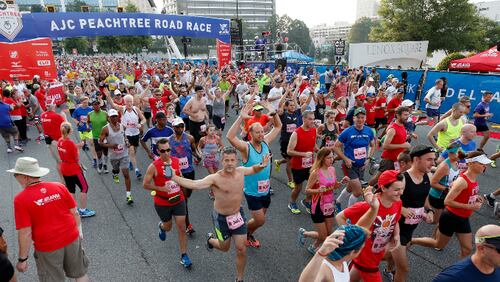 Racers begin at the starting line from Lenox Square during the 47th running of the AJC Peachtree Road Race Monday July 4, 2016, in Atlanta, Ga.