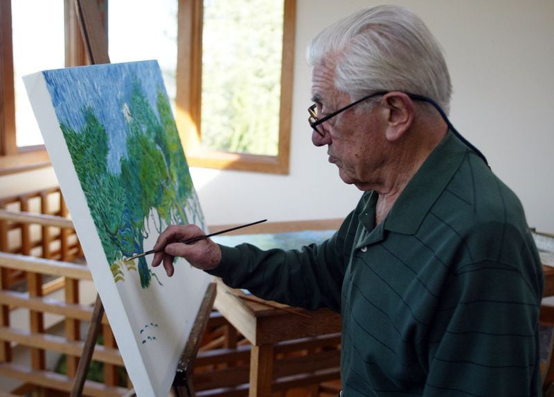 Dr. John Galambos paints works by Van Gogh and Mondrian as a hobby. Phil Skinner/AJC staff