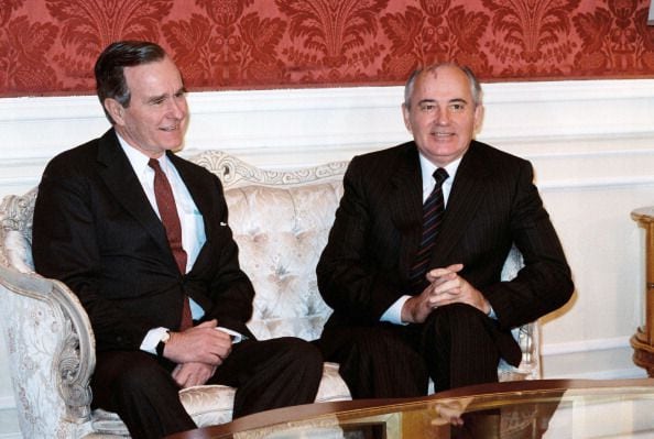 1987: Soviet leader Mikhail Gorbachev (R) meets with US Vice-President George Bush at the Soviet embassy