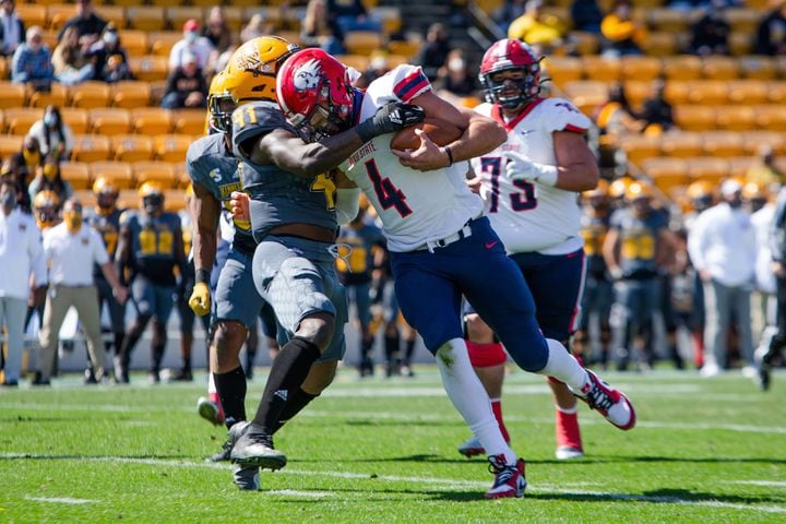 Kody Wilstead (right) of Dixie State is tackled by Kareem Taylor (left) of Kennesaw State. CHRISTINA MATACOTTA FOR THE ATLANTA JOURNAL-CONSTITUTION.