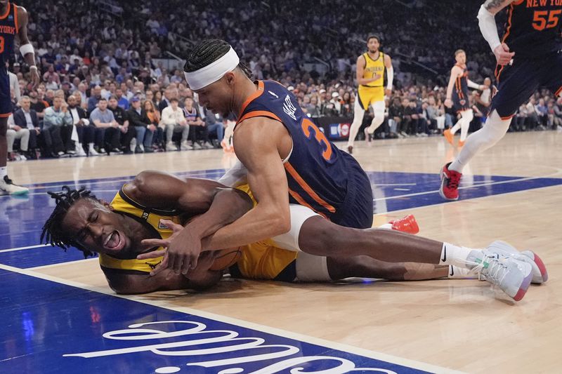 New York Knicks' Josh Hart (3) fights for control of the ball with Indiana Pacers' Aaron Nesmith during the first half of Game 2 in an NBA basketball second-round playoff series Wednesday, May 8, 2024, in New York. (AP Photo/Frank Franklin II)
