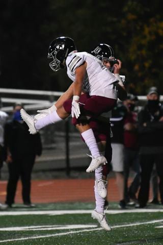 Alpharetta's Jake Gil, near, celebrates a TD with a teamate during a high school football game against Roswell on Friday, Nov.13, 2020 in Roswell. (JOHN AMIS FOR THE ATLANTA JOURNAL-CONSTITUTION)