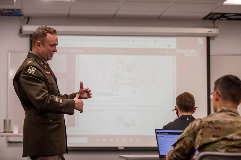 U.S. Army Reserve Maj. Garrett Cathcart interacts with students while teaching Military Science 101 at Georgia Tech in Atlanta, Tuesday, August 24, 2021. Cathcart is an assistant professor at the school, which was ranked by U.S. News & World Report as being one of the nation's top colleges for veterans. (Alyssa Pointer/Atlanta Journal Constitution)
