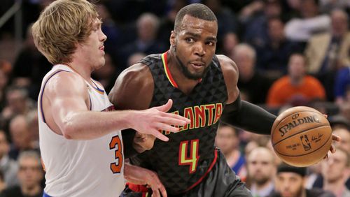 Atlanta Hawks’ Paul Millsap, right, pushes past New York Knicks’ Ron Baker during the second half of the NBA basketball game, Monday, Jan. 16, 2017 in New York. The Hawks defeated the Knicks 108-107. (AP Photo/Seth Wenig)