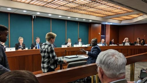 State Rep. Demetrius Douglas, D-Stockbridge, recognizes an old ally in Pierce Mower. The fifth grader testified Monday for a Douglas' House Bill 83 mandating recess in elementary school. Pierce, accompanied  by buddy Ephraim Lane, had testified two years ago for a prior version of Douglas’ recess bill.