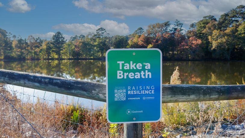 A new joint effort between Children’s Healthcare of Atlanta, Live Healthy Gwinnett and Gwinnett Parks and Recreation has placed scannable signs along walking paths to virtually introduce children and families to healthy habits and coping skills. COURTESY GWINNETT COUNTY