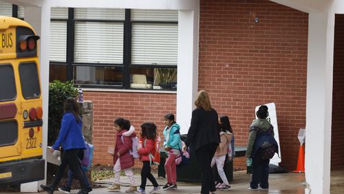 Students at Laurel Ridge Elementary leave the school during dismissal on Tuesday, January 17, 2023. Concerns and frustrations keep growing among parents at the school, where a series of outgoing issues have delayed the replacement of lead-tainted windows.Miguel Martinez / miguel.martinezjimenez@ajc.com