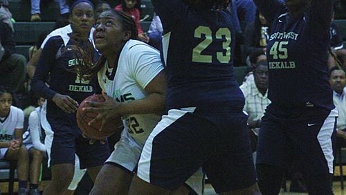 Arabia Mountain's Iyania Kitchens muscles her way to the basket (Photo - Mark Brock)