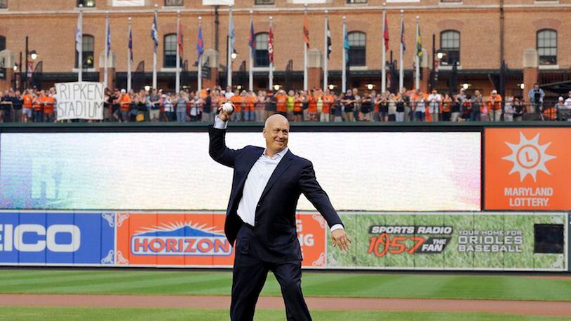 Former Baltimore Oriole Cal Ripken, Jr., throws out the ceremonial first pitch to mark the twentieth anniversary of his streak of 2,131 straight games before a baseball game between the Orioles and the Tampa Bay Rays, Tuesday, Sept. 1, 2015, in Baltimore. (AP Photo/Patrick Semansky)