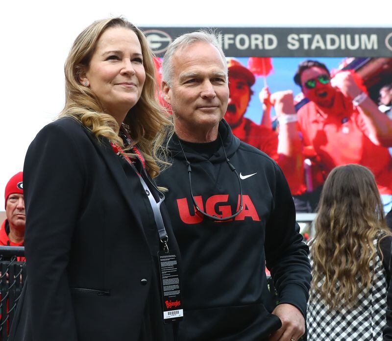 Former Georgia head coach Mark Richt stands with his wife Katharyn as he is cheered by Georgia fans in Sanford Stadium during the game against Missouri in a NCAA college football game on Saturday, Nov. 6, 2021, in Athens.  “Curtis Compton / Curtis.Compton@ajc.com”