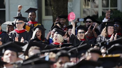 Emory University School of Theology graduates cheer as their degrees are conferred during the May 2019 commencement ceremony. Some international students there are experiencing delays getting permits to work internships. BOB ANDRES / BANDRES@AJC.COM