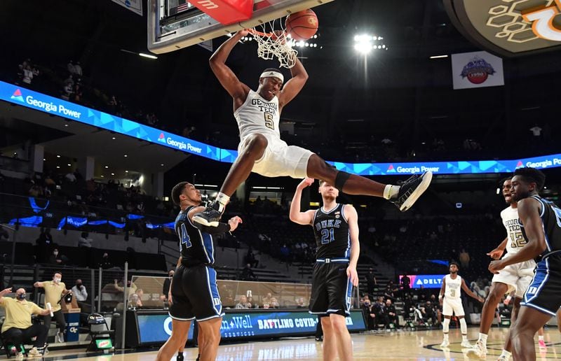 Georgia Tech forward Moses Wright (5) hangs on the basket after a dunk  in the second half against Duke Tuesday, March 2, 2021, at McCamish Pavilion in Atlanta. Tech won 81-77 in overtime. (Hyosub Shin / Hyosub.Shin@ajc.com)