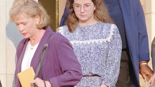 Susan Smith center is escorted from the Union County Courthouse in Union S C on Tuesday July 11 1995 A judge ruled Tuesday that she was competent to stand trial for the murder of her two sons Alex and Micahel Jury selection also began for the trial which is expected to run up to six weeks in length (AP Photo Dave Martin)