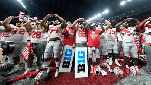 Ohio State players celebrate the team's 34-21 win over Wisconsin in the Big Ten championship Sunday, Dec. 8, 2019, in Indianapolis. (AJ Mast/AP)