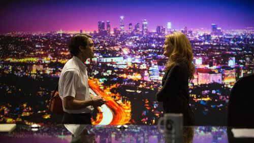 In this image released by Open Road Films, Jake Gyllenhaal, left, and Rene Russo appear in a scene from the film, "Nightcrawler." (AP Photo/Open Road Films, Chuck Zlotnick)