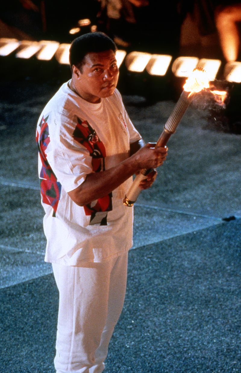Muhammad Ali watches the wick that is about to ignite the Olympic Caldron during the Opening Ceremonies for the 1996 Summer Olympic Games Friday, July 19, 1996 at the Olympic Stadium in Atlanta.  (Allen Eyestone/AJC)