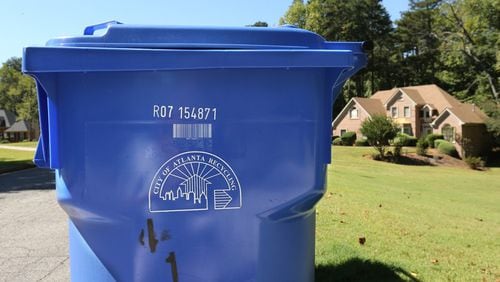 A team of city of Atlanta employees will inspect recycling bins on four of the city’s recycling routes to determine if they are contaminated or acceptable during the eight week “Feet on the Street” project. AJC file photo.