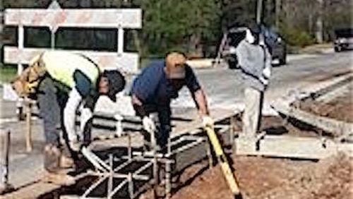 Sidewalk construction begins along Buford Highway from Jimmy Carter to Beaver Ruin in Norcross. Courtesy of city of Lilburn